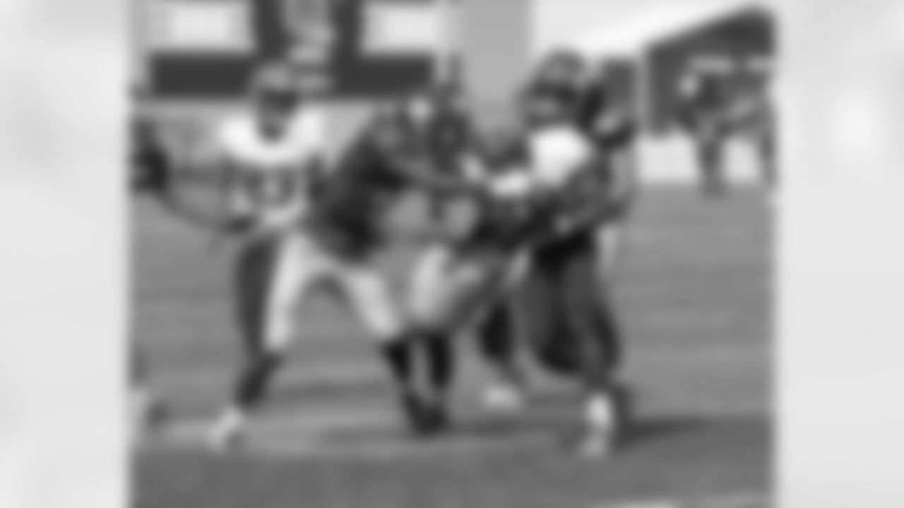 New York Giants linebacker Devante Downs (52)] and  cornerback Madre Harper (45) make a tackle during a NFL Training Camp joint practice at the Cleveland Browns practice facility  on Thursday August 19, 2021 in Berea, Ohio