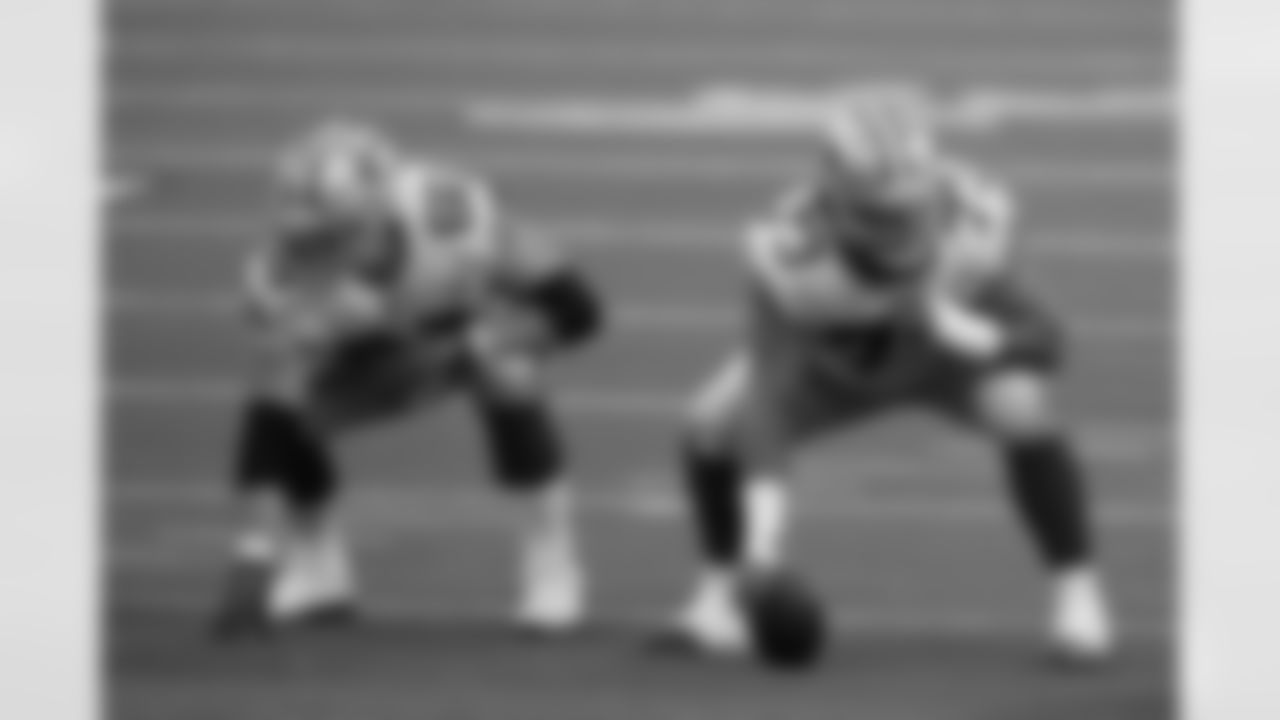 Dallas Cowboys guard Connor McGovern (66) and center Joe Looney (73) get set during an NFL game against the Philadelphia Eagles, Sunday, Dec. 27, 2020, in Arlington, Texas. The Cowboys beat the Eagles 37-17. (Cooper Neill via AP)