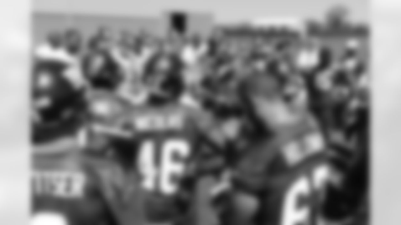 Coach Tom Coughlin huddles his team together for day 2 of rookie minicamp.