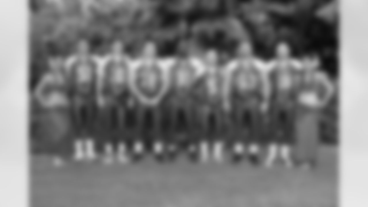 Hula girls flank members of the NFC All-Stars (L-R) Zak DeOssie #51, Eli Manning #10, Chris Snee #76, Justin Tuck #91, John Carney #5, Shaun O'Hara #60, and Jeff Feagles #18 of the New York Giants at team photo day the week of the 2009 NFL Pro Bowl at the Ihilani Resort and Spa on February 6, 2009 in Kapolei, Hawaii. (AP Photo/Paul Spinelli)