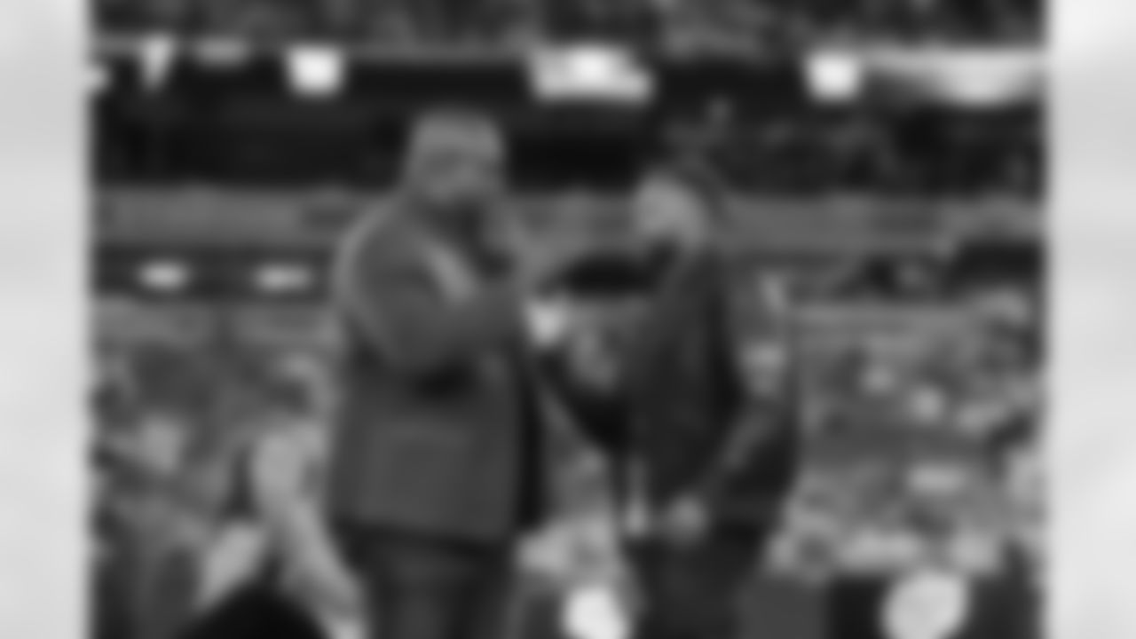Rodney Hampton gets a hand shake from his son during a Monday Night football game against the Dallas Cowboys on Monday September 26, 2022 in East Rutherford, New Jersey (Evan Pinkus/NY Giants)