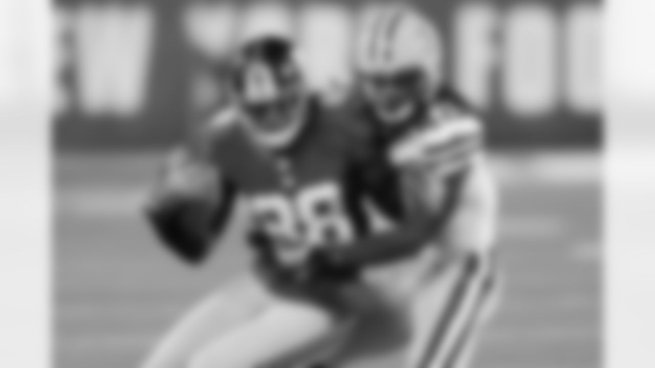 Green Bay Packers' Morgan Burnett (42) tackles New York Giants wide receiver Hakeem Nicks (88) during the first half of an NFL football game