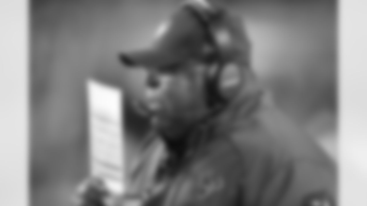 Houston Texans defensive coordinator Romeo Crennel hides his mouth with his play chart as he talks on his headsets on the sideline during the 2015 week 10 regular season NFL football game against the Cincinnati Bengals on Monday, Nov. 16, 2015 in Cincinnati. The Texans won the game 10-6. (Paul Spinelli via AP)