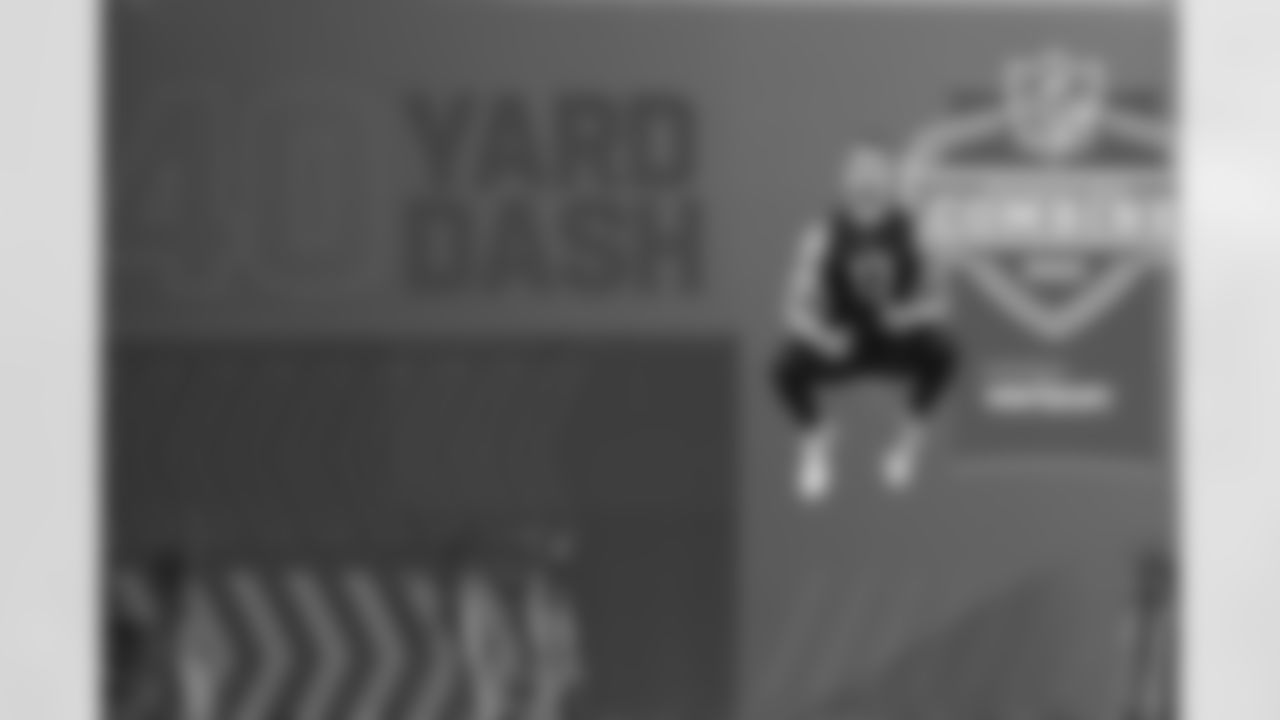 Cincinnati quarterback Desmond Ridder jumps before he runs the 40-yard dash during the NFL football scouting combine, Thursday, March 3, 2022, in Indianapolis. (AP Photo/Darron Cummings)