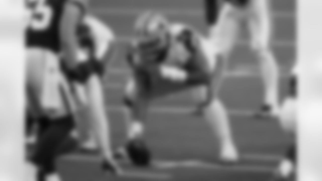 Dallas Cowboys center Joe Looney (73) gets set on the line of scrimmage during an NFL game against the Washington Football Team, Thursday, Nov. 26, 2020, in Arlington, Texas. Washington beat the Cowboys 41-16. (Cooper Neill via AP)