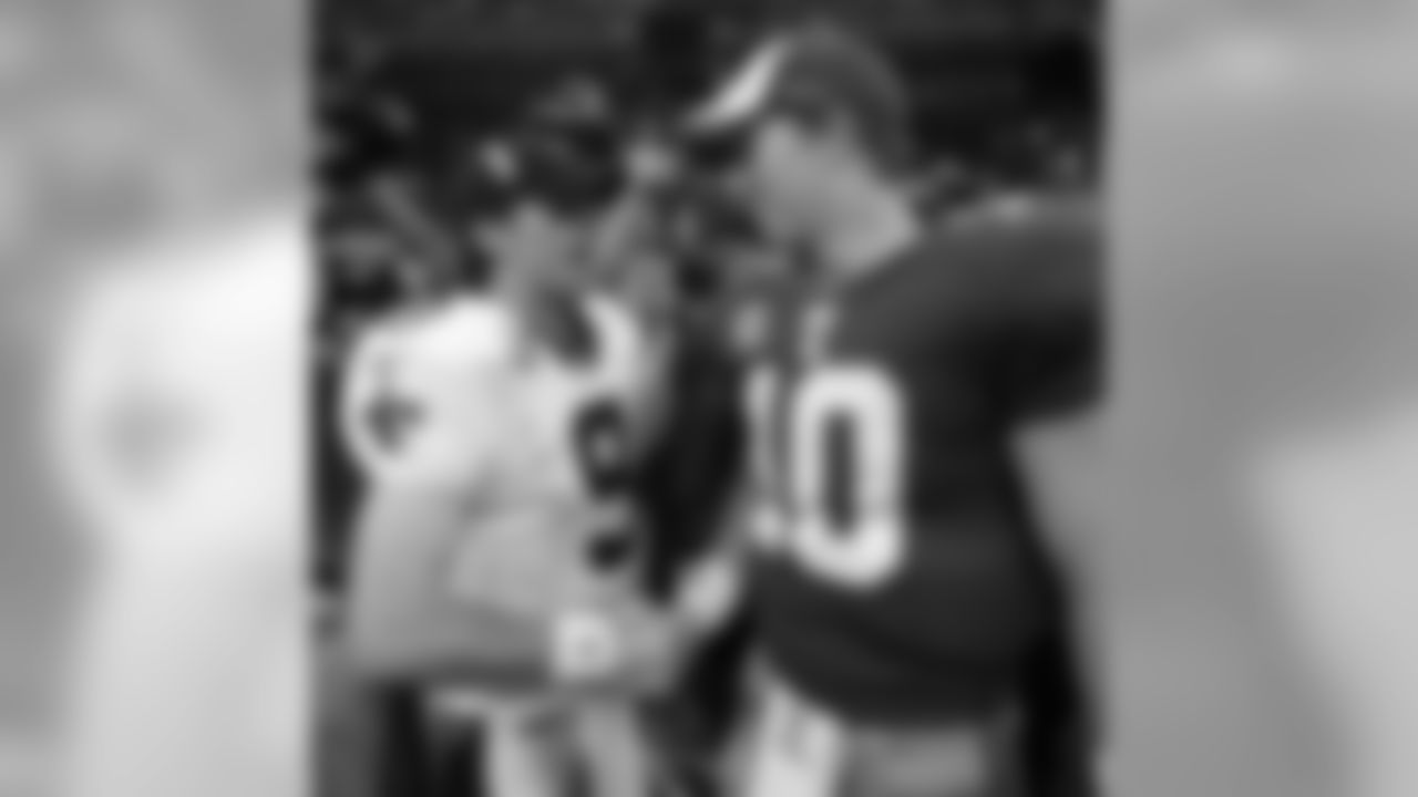 New Orleans Saints quarterback Drew Brees (9) and New York Giants quarterback Eli Manning (10) shake hands after an NFL football game in New Orleans, Sunday, Oct. 18, 2009. The Saints beat the Giants 48-27. (AP Photo/Patrick Semansky)