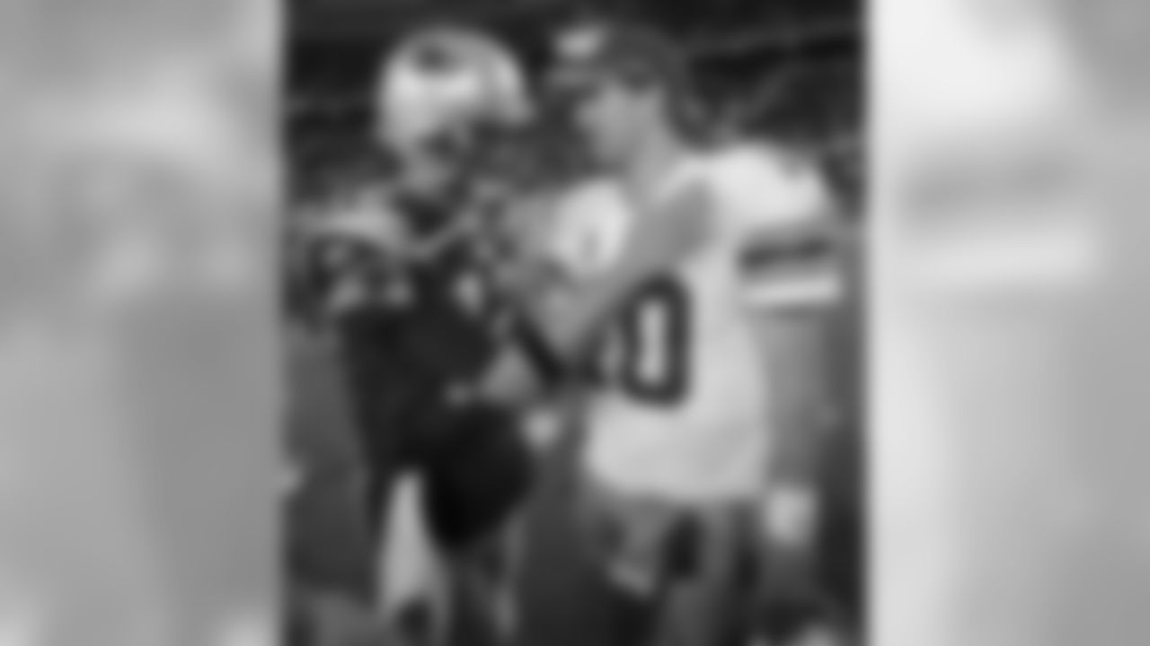 New York Giants' Eli Manning, right, is congratulated by New England Patriots' Tom Brady after the Giants' 24-20 win in an NFL football game in Foxborough, Mass., Sunday, Nov. 6, 2011. (AP Photo/Charles Krupa)