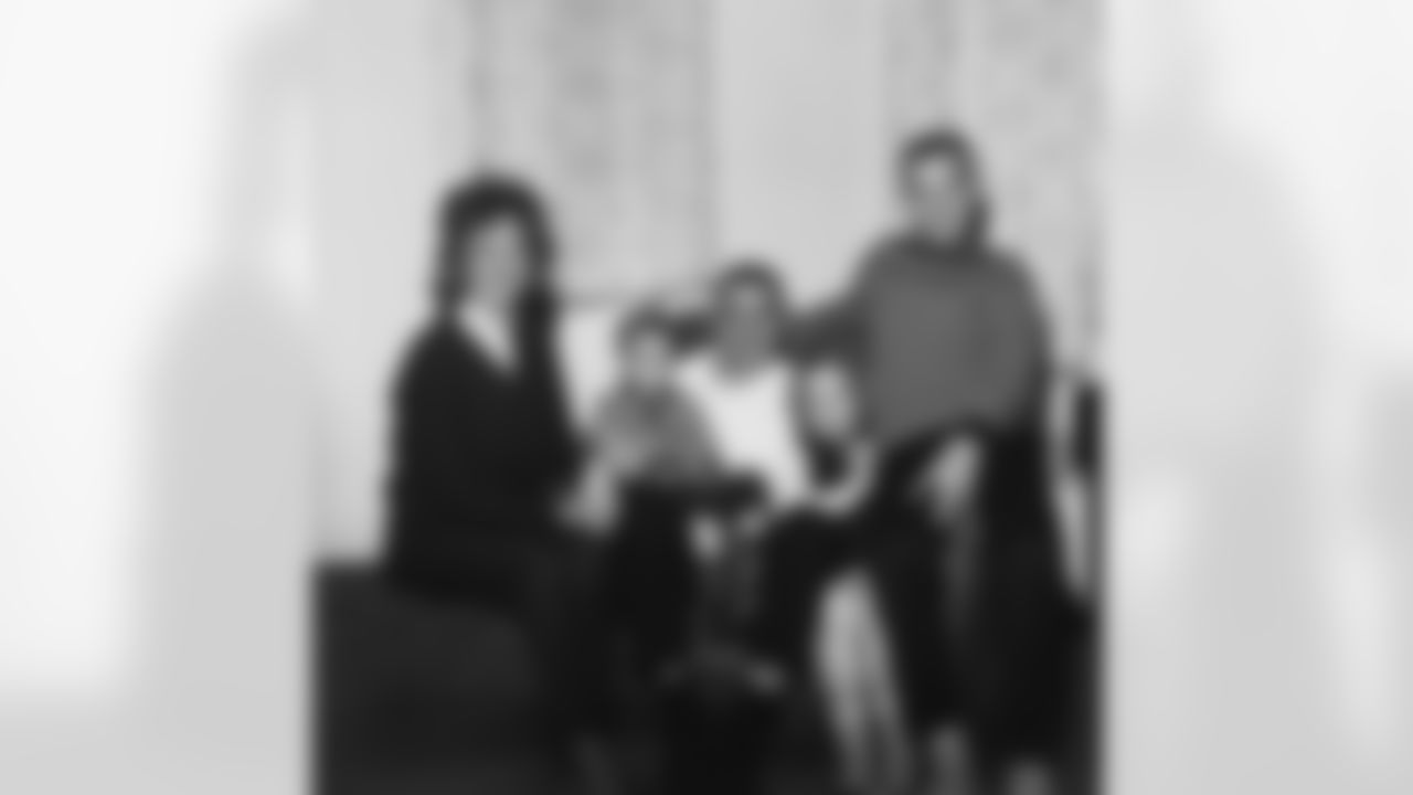 Linebacker Sam Huff, who was traded from the New York Giants to the Washington Redskins, shown with his family in their Flushing, New York home on April 10, 1964. They are, left to right: wife Mary; son J.D., 4; Sam; Cathy, 6; Sammy Lee, 12. Along with rookie lineman George Seals, Huff was exchanged for the Redskins' defensive end Andy Stynchula and halfback Dick James. (AP Photo)