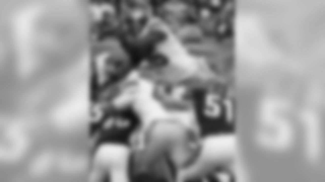 Running back Andre Brown (35) jumps over the pile to score a touchdown