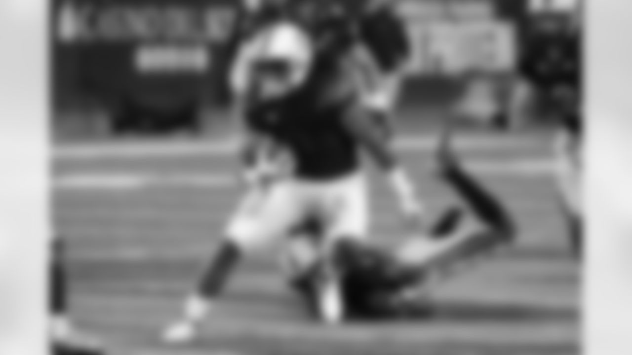 Arizona running back Gary Brightwell (0) runs the ball against Arizona State in the first half of an NCAA college football game, Friday, Dec. 11, 2020, in Tucson, Ariz. (AP Photo/Rick Scuteri)
