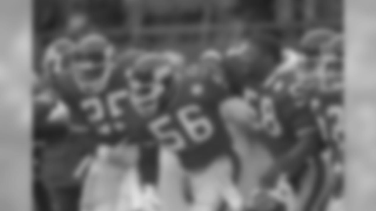 Lawrence Taylor is congregated by Mark Collins and Carl Banks after his interception and touchdown run on a Joe Montana pass on Sunday, Jan. 4, 1986 in East Rutherford, N.J. (AP Photo/Ray Stubblebine)