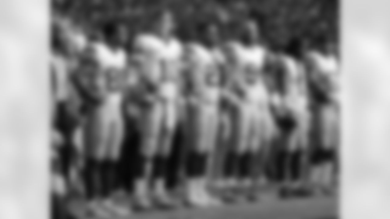 New York Giants line up to sing the national anthem before an NFL football game between New York Giants and Los Angeles Rams at Twickenham stadium in London, Sunday Oct. 23, 2016. (AP Photo/Matt Dunham)