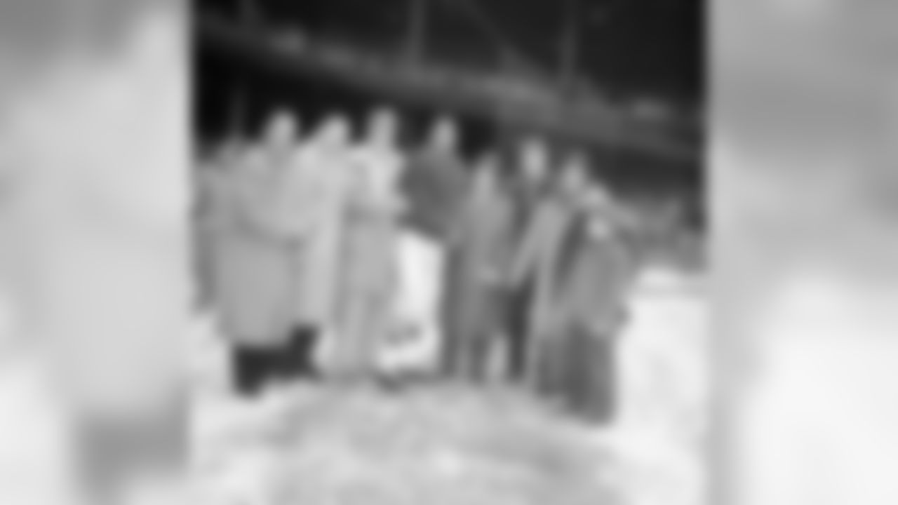 New York Giants' star defensive back, Emlen Tunnell, poses with a group from Radnor High School of Wayne, Penn., before the Giants-Cleveland Browns game in New York, Dec. 14, 1958. From left: Ben Domenick, Art Lang, manager; Jules Provost, coach; Tunnell; Jerry Domenick, team captain; Steve Domenick, 12, and Jimmy Thomas, 9. Tunnell was honored by fans before the game including the Radnor group. (AP Photo/John Lindsay)