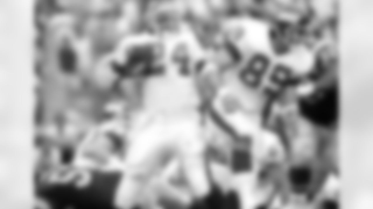 With teammate Mark Bavaro (89) leading the way, New York Giants running back Ottis Anderson (24) gains nine yards of his team-leading 60 yards during third quarter action against the Los Angeles Rams in Anaheim, Calif., Nov. 12, 1990. On the same possession Anderson scored on a three-yard touchdown run. New York marched to a 31-7 win to remain unbeaten. (AP Photo/Craig Fuji)