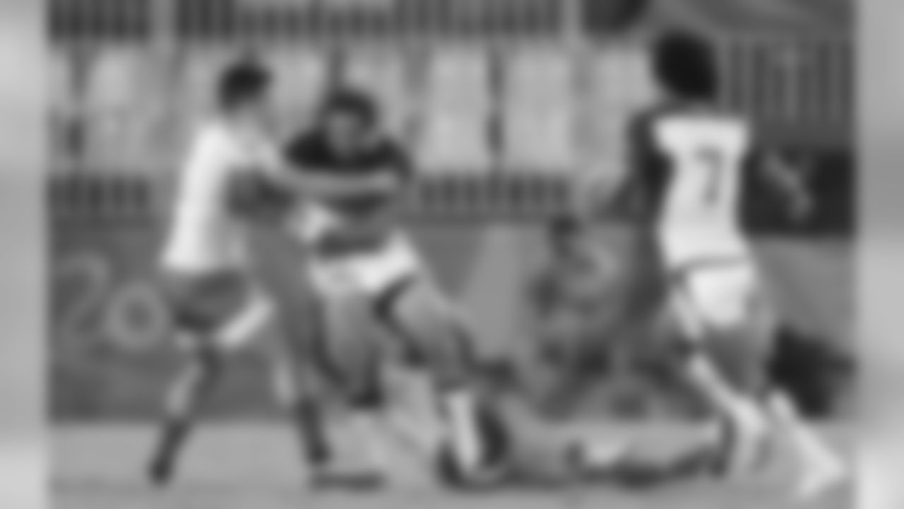 United States's Nate Ebner, second from left, is tackled by Brazil's Daniel Sancery, during the men's rugby sevens match at the Summer Olympics in Rio de Janeiro, Brazil, Tuesday, Aug. 9, 2016. (AP Photo/Themba Hadebe)
