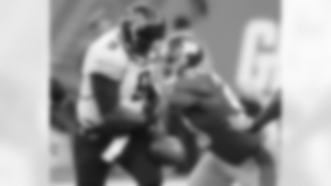 DE Jason Pierre-Paul strips the ball from Jaguars QB David Gerrard.