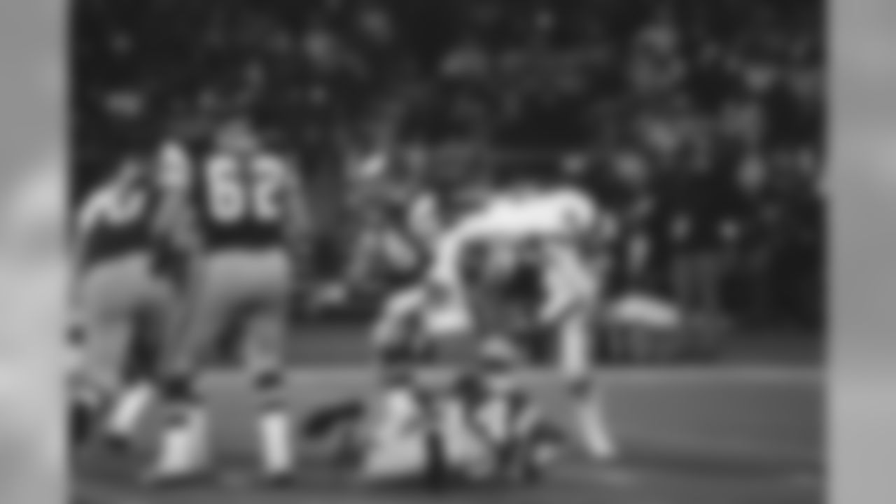 New York Giants Dee Hardison takes a ride on the back of Eagles quarterback Ron Jaworski in wild card playoff game, Dec. 28, 1981, Philadelphia, Pa. Jaworski had a tough day as New Yorks defense limited Jaworski to less than 50 percent of pass completions and sacked him three times. Eagles lost, 27-21. Eagles Hubert Oliver (34), Pete Perot (62) and Jerry Sisemore (76) are also shown. (AP Photo)