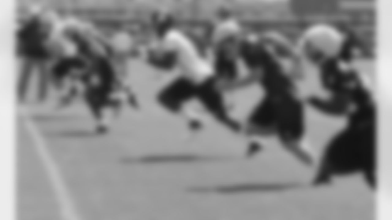 Players run downfield on a kickoff during day 2 of rookie minicamp.