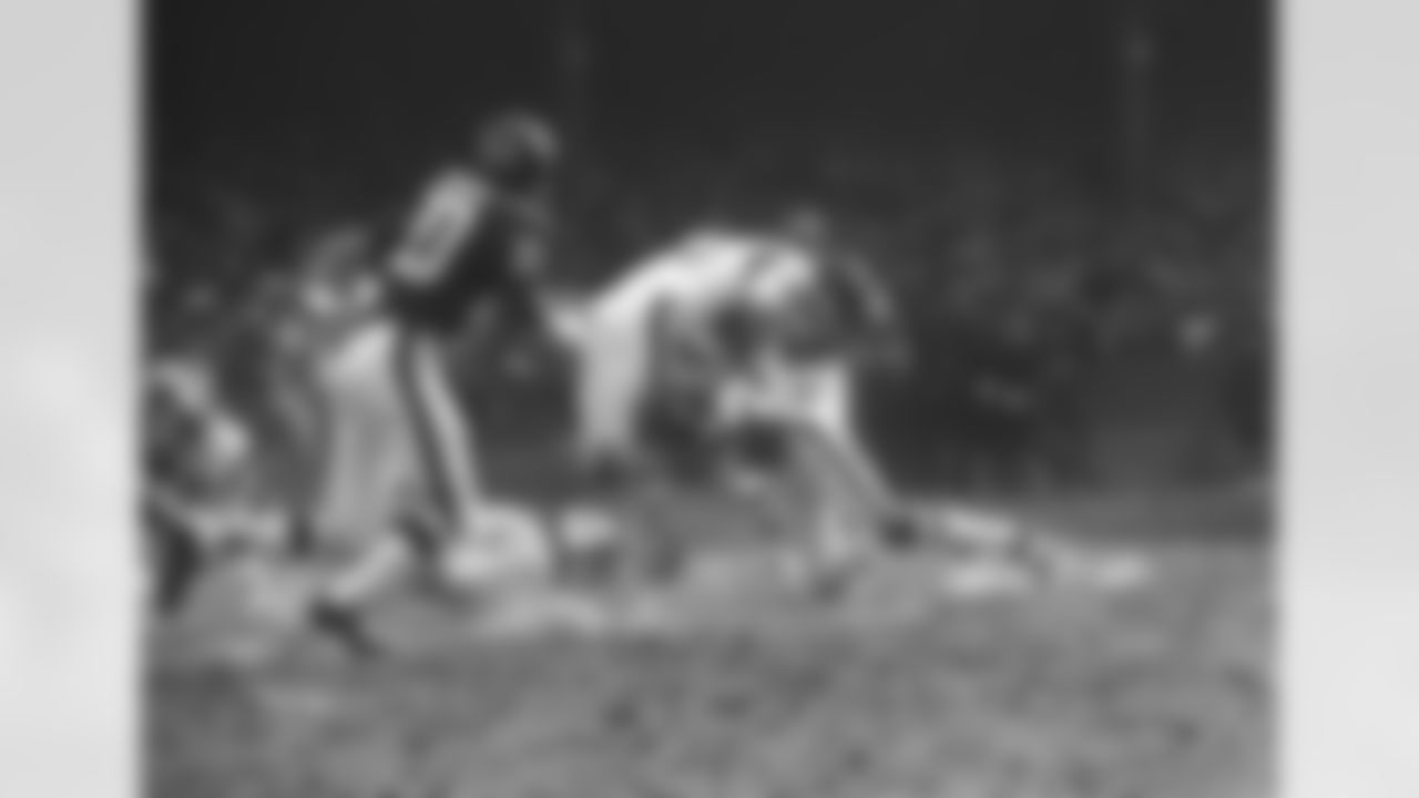 Les Josephson (34) of the Los Angeles Rams runs into a driving tackle by New York Giants Tom Longo (44) after a short gain in the first period of their game at Yankee Stadium, Dec. 20, 1970, New York. Giants Spider Lockhart (43) got a piece of the tackle. Coming up to help are Giants Scott Eaton (20) and Willie Williams (41). (AP Photo)