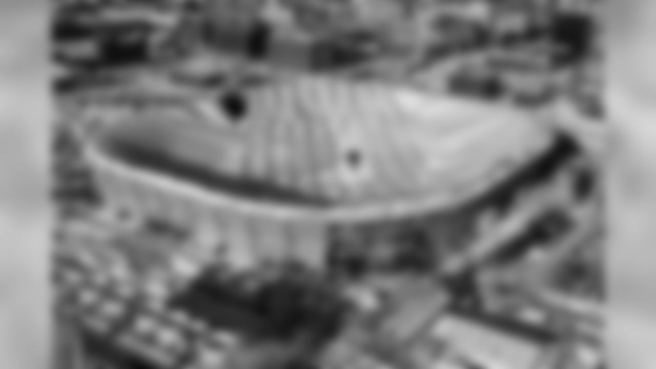 Holes in the collapsed Metrodome roof can be seen in Minneapolis Sunday, Dec. 12, 2010. The inflatable roof of the Metrodome collapsed Sunday after a snowstorm that dumped 17 inches on Minneapolis. No one was hurt, but the roof failure sent the NFL scrambling to find a new venue for the Vikings' game against the New York Giants. (AP Photo/Ann Heisenfelt)