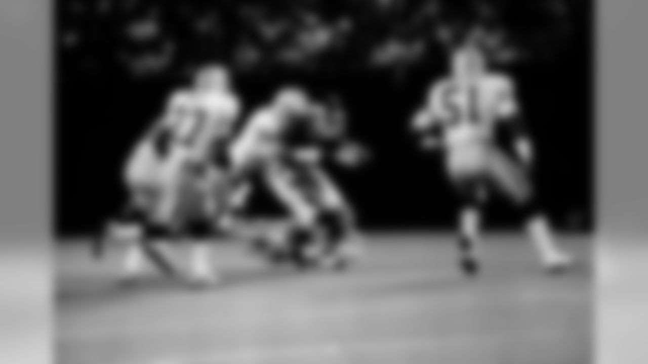 New York Giants Phil McConkey carries the ball for short yardage as John Dorsey (99) and Delbert Fowler (56) of the Green Bay Packers bring an end to the play in the NFL pre-season game at Giants Stadium in East Rutherford, N.J., Aug. 17, 1985. (AP Photo/Ron Frehm)