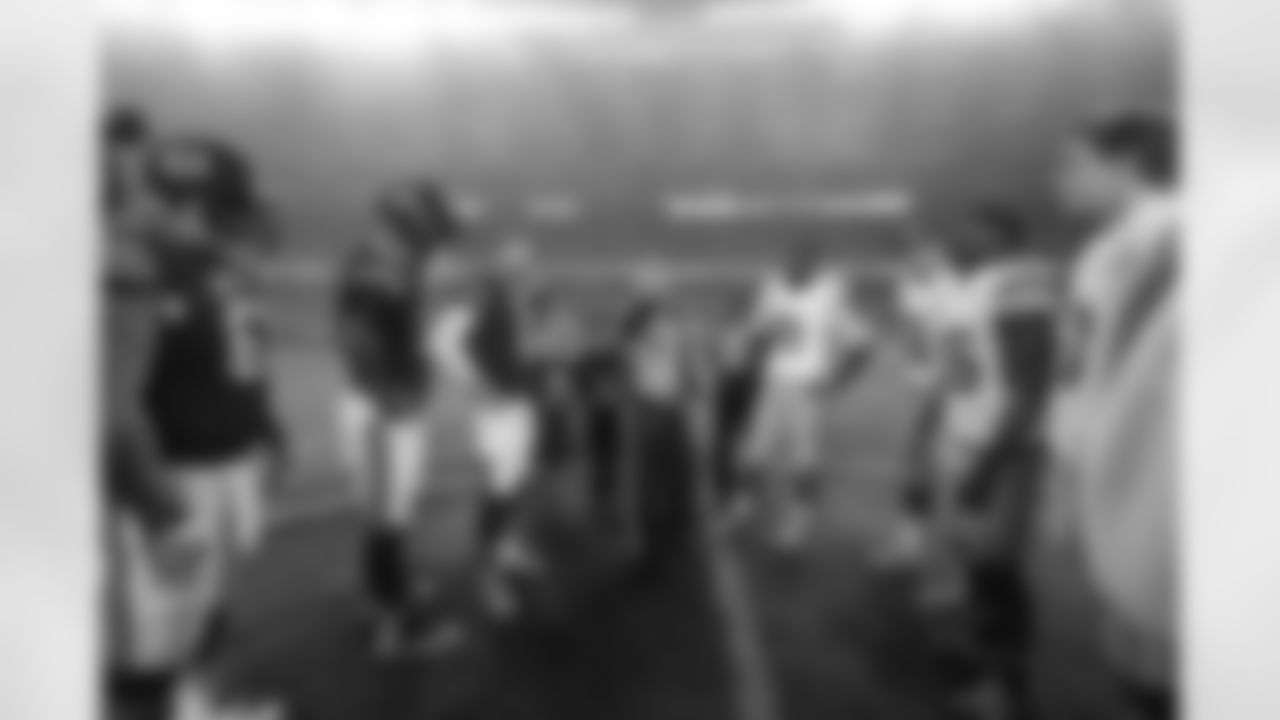 Players gather on the field for the coin toss before an NFL football game between the Chicago Bears and the New York Giants, Thursday, Oct. 10, 2013, in Chicago. (AP Photo/Nam Y. Huh)