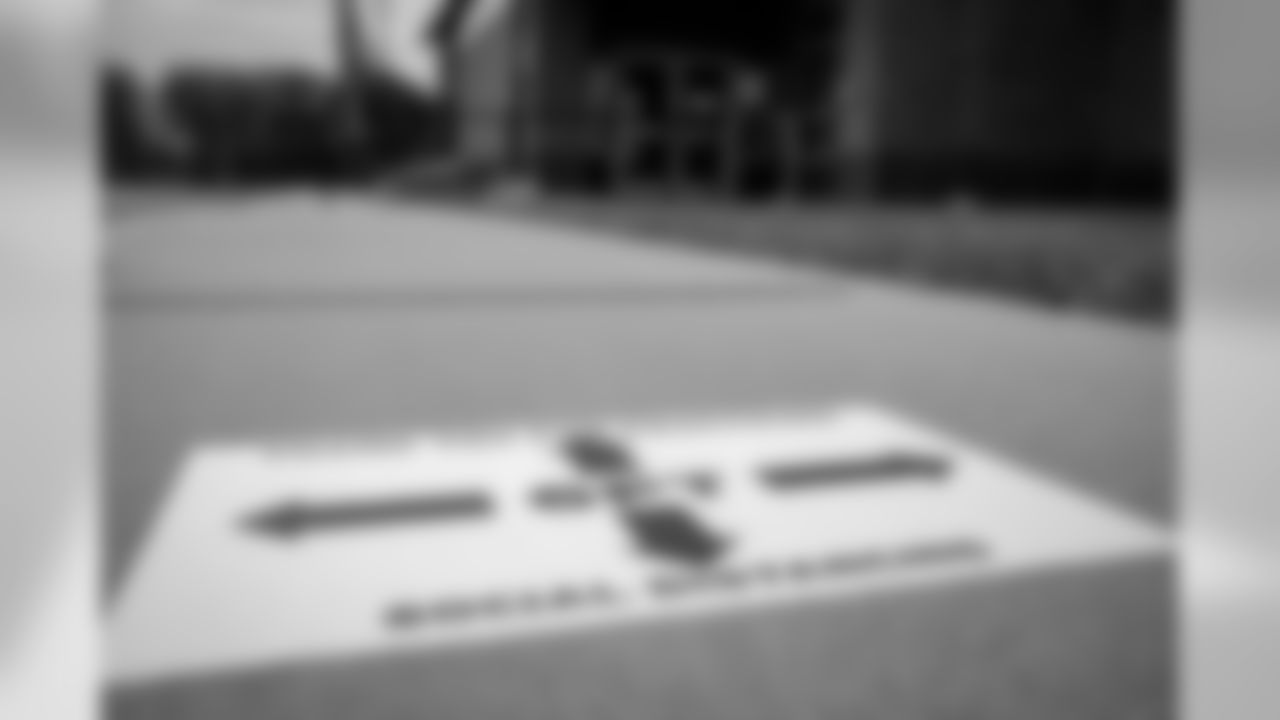 From the time they enter the parking lot to walking into the building, employees must remain six feet apart from others. There are markings on the ground.