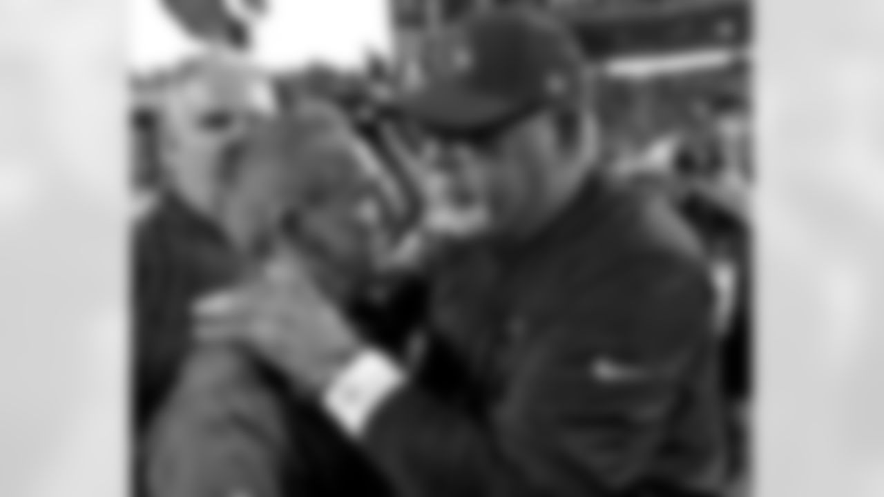 Arizona Cardinals head coach Bruce Arians, right, greets New York Giants head coach Steve Spagnuolo after an NFL football game, Sunday, Dec. 24, 2017, in Glendale, Ariz. The Cardinals won 23-0. (AP Photo/Ross D. Franklin)