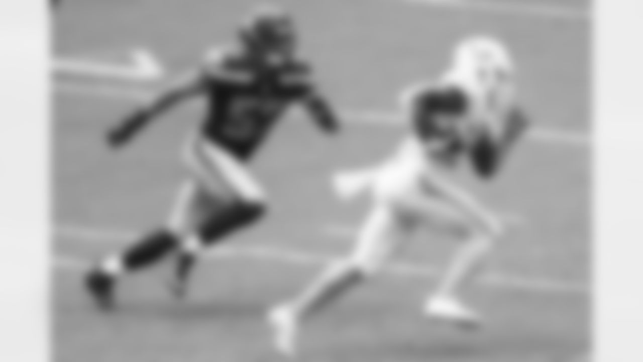 Miami Dolphins running back Matt Breida (22) runs the ball as Seattle Seahawks linebacker Cody Barton (57) defends during an NFL football game, Sunday, Oct. 4, 2020, in Miami Gardens, Fla. Seattle won 31-23. (Logan Bowles via AP)