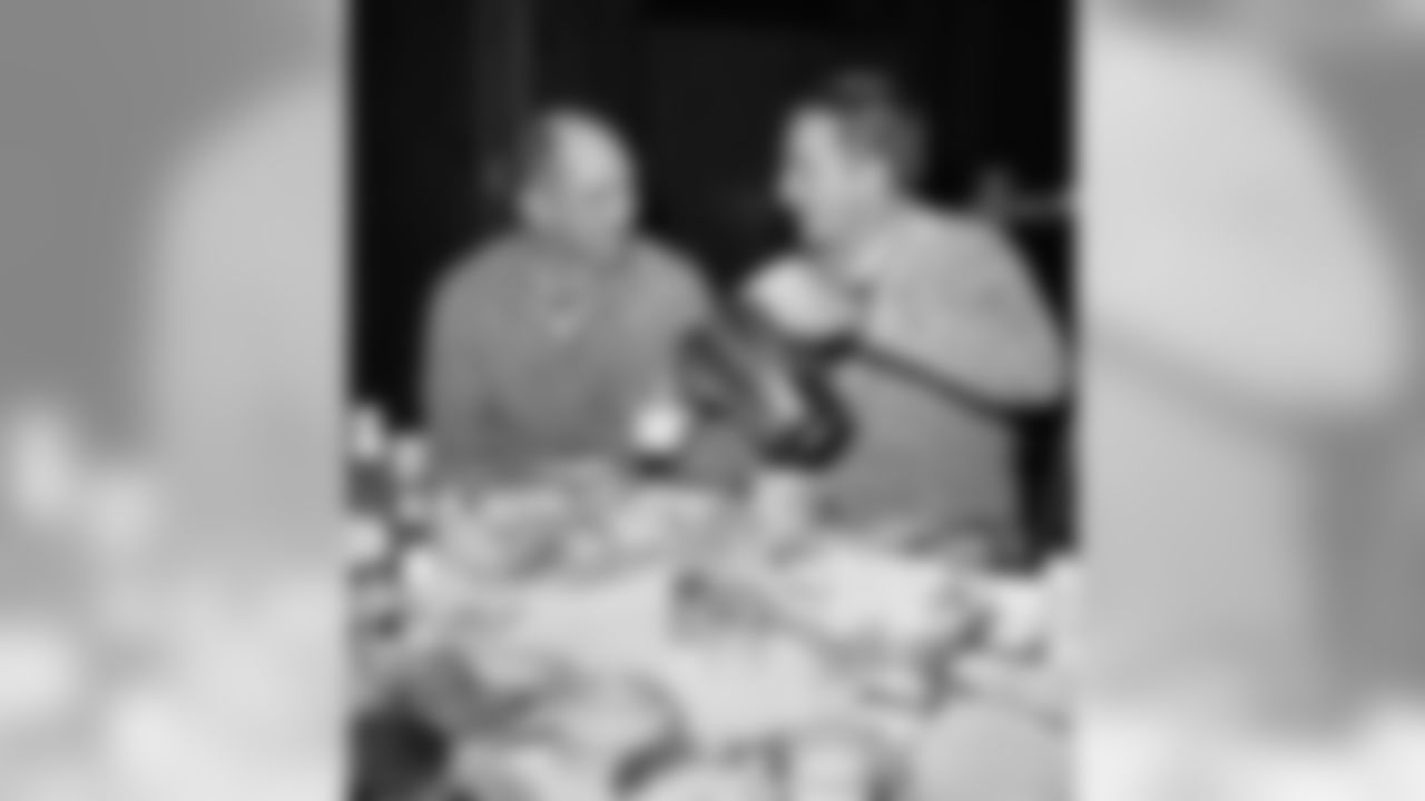 New York Giants quarterback Y.A. Tittle, left, and teammate end Del Shofner talk as they sit in Bear Mountain Inn, Bear Mountain, New York on Dec. 26, 1962. The New York team is staying at the Inn and travels to nearby West Point for indoor workouts. The Giants will meet the Green Bay Packers on December 30 at Yankee Stadium in New York for the National Football League Championship. (AP Photo)