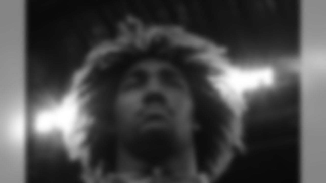 USC defensive lineman Leonard Williams stretches before drills at the NFL football scouting combine in Indianapolis, Sunday, Feb. 22, 2015. (AP Photo/Julio Cortez)
