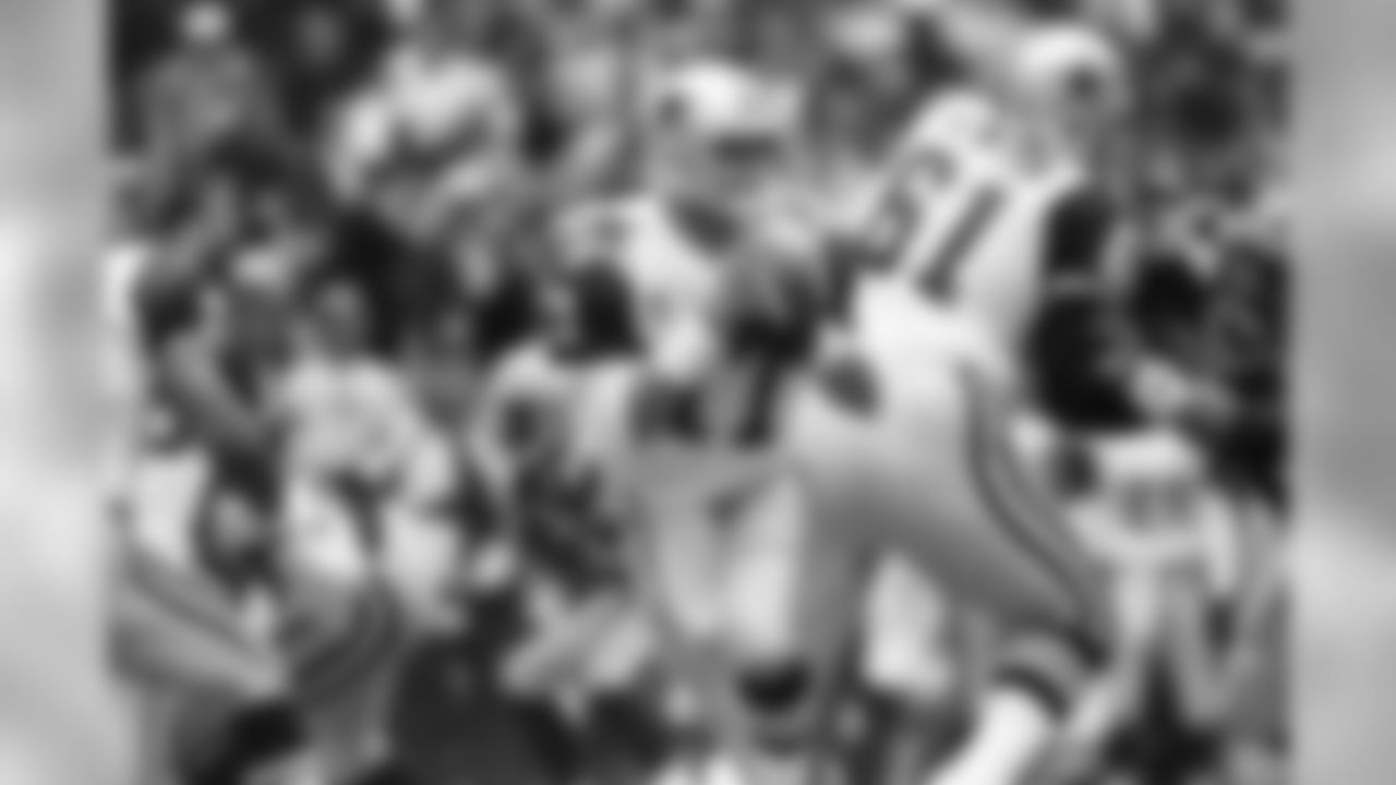 Dallas Cowboys quarterback Jason Garrett looks for a receiver downfield in the first quarter against the Green Bay Packers in Irving, Texas on Thursday, Nov. 24, 1994. Garrett had 311 passing yards in his first start this year. Dallas won, 42-31. (AP Photo/Pat Sullivan)