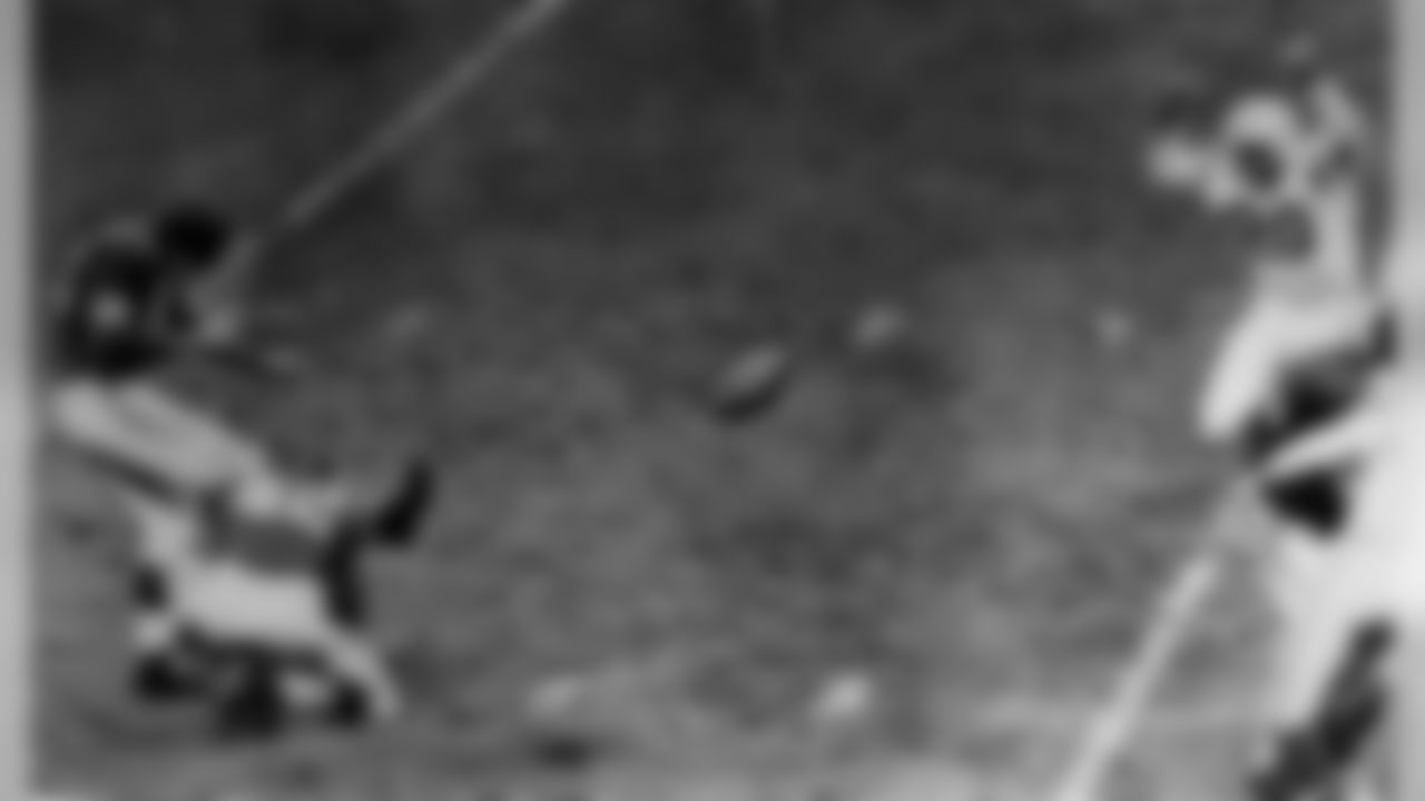 New York Giants' Pat Summerall kicks for 28 yards and a field goal with less than three minutes to play Nov. 9, 1958, to win the game against the Baltimore Colts in New York's Yankee Stadium. Holiding for the kick is Charley Conerly. Giants won 24-21. Colts, right, are halfback Milt Davis (20), and Andy Nelson (80). Summerall also kicked the three points after touchdown for the Giants. (AP photo/Harry Harris)
