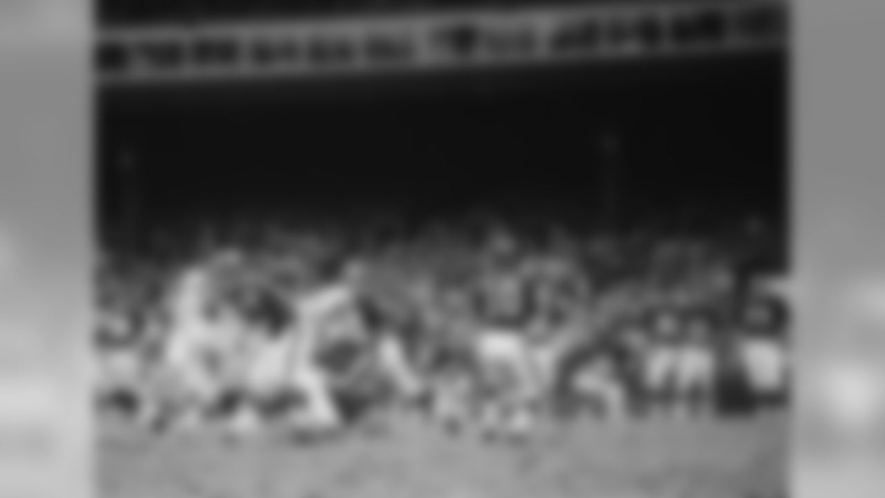 New York Giants Greg Larson (53) blocks for Fran Tarkenton (10) during a game agains the Baltimore Colts on November 3,1968 at Yankee Stadium in the Bronx, New York. The Baltimore Colts beat the New York Giants 26-0. Greg Larson played for 13 years, all with the New York Giants and was a 1-tim Pro Bowler(David Durochik via AP)
