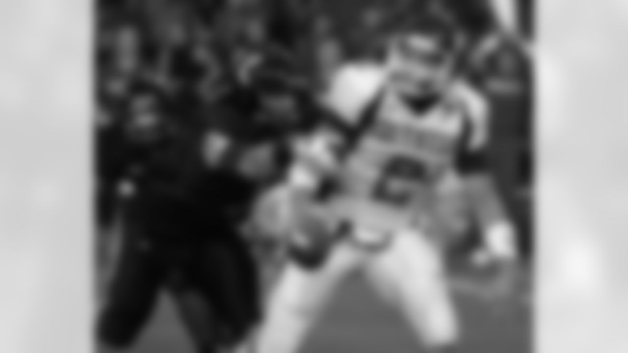 Eastern Kentucky quarterback Allan Holland (2) is sacked by Cincinnati defensive end Connor Barwin (5) in the first half of a college football game, Thursday, Aug. 28, 2008, in Cincinnati. (AP Photo/Al Behrman)
