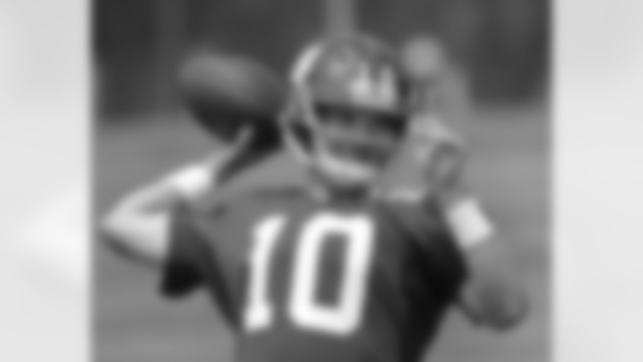 New York Giants quarterback Eli Manning drops back for a pass at the New York Giants NFL football training camp in Albany, N.Y.