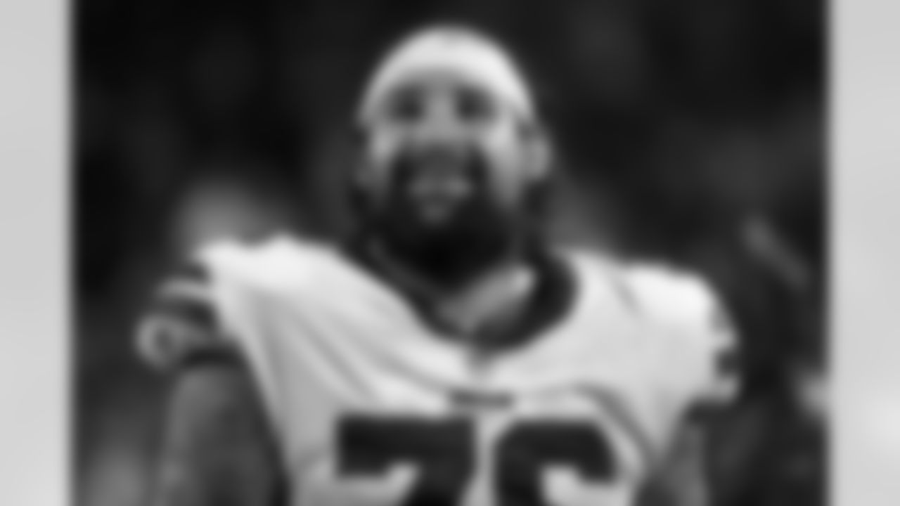Buffalo Bills guard Jon Feliciano (76) smiles on the bench during an NFL game against the Kansas City Chiefs, Sunday, Oct. 10, 2021 in Kansas City, Mo. The Bills defeated the Chiefs 38-20. (Kevin Sabitus via AP)