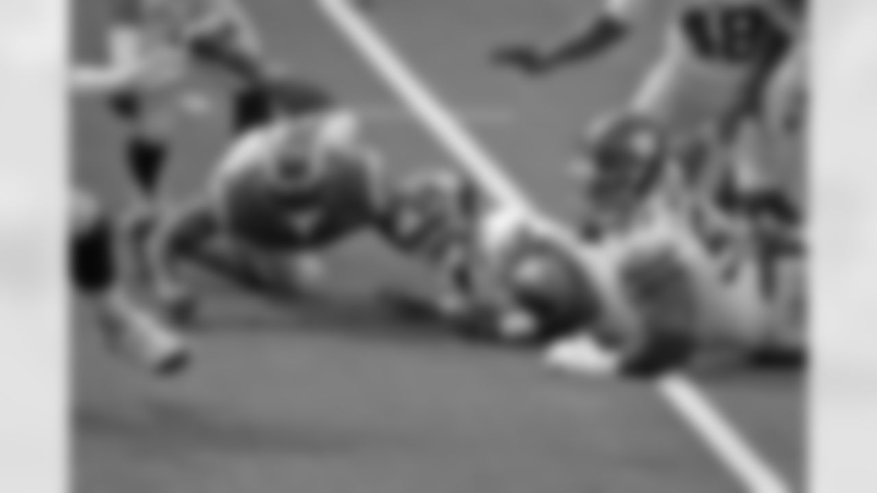 Los Angeles Rams tight end Gerald Everett, left, fumbles the ball which would then be recovered by the New York Giants during the first half of an NFL football game Sunday, Oct. 4, 2020, in Inglewood, Calif. (AP Photo/Jae C. Hong)