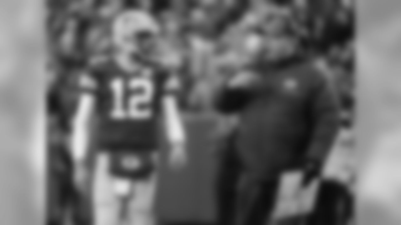 Green Bay Packers head coach Mike McCarthy talks to Aaron Rodgers during the first half of an NFL football game against the Miami Dolphins Sunday, Nov. 11, 2018, in Green Bay, Wis. (AP Photo/Mike Roemer)