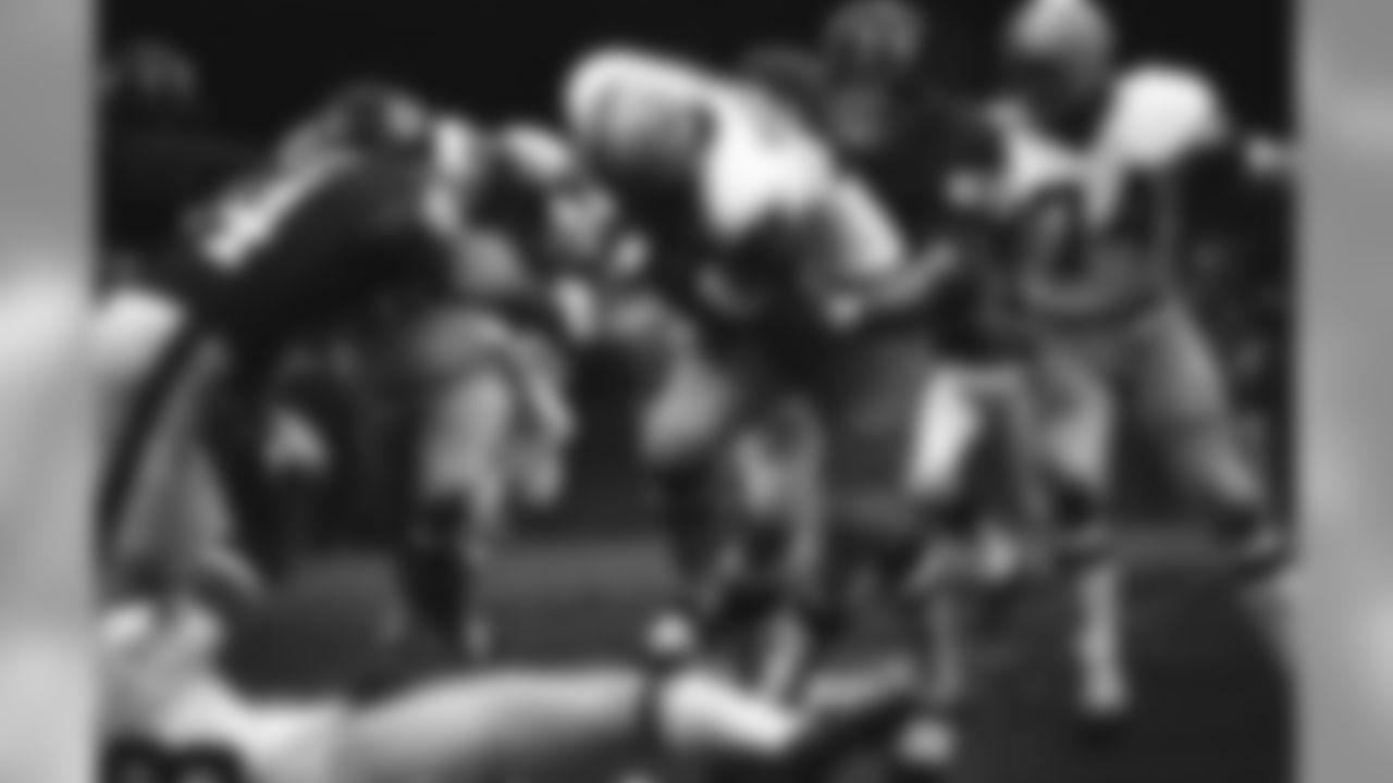 Washington Redskins running back Charley Harraway (31) is held to a no gain by New York Giants Jim Files (58) during the first quarter at Yankee Stadium, Nov. 15, 1970, New York. Giants won, 35-33. The rest of the players are unidentified. (AP Photo/Harry Harris)
