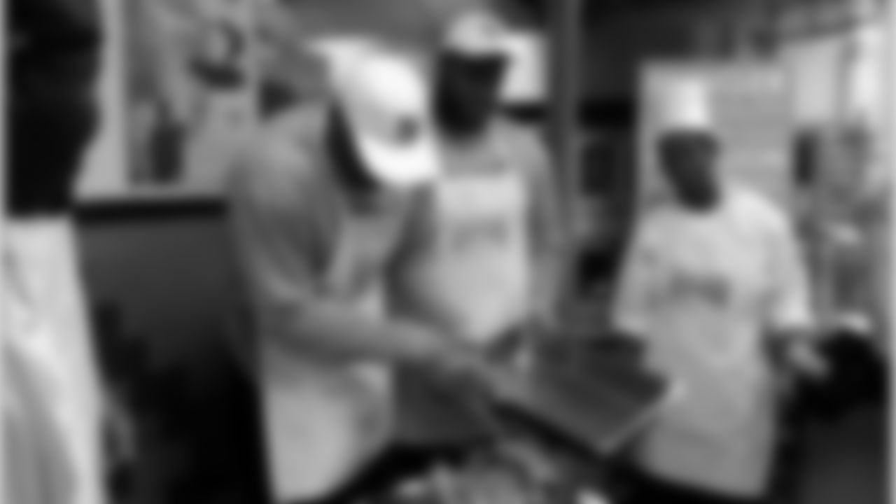 Food Bank for NYC: On Tuesday, November 23rd, Chris Canty, Jason Pierre-Paul and Linval Joseph volunteered at the Food Bank for NYC in Harlem. They helped unload turkeys and then served a hot meal to all those who came.