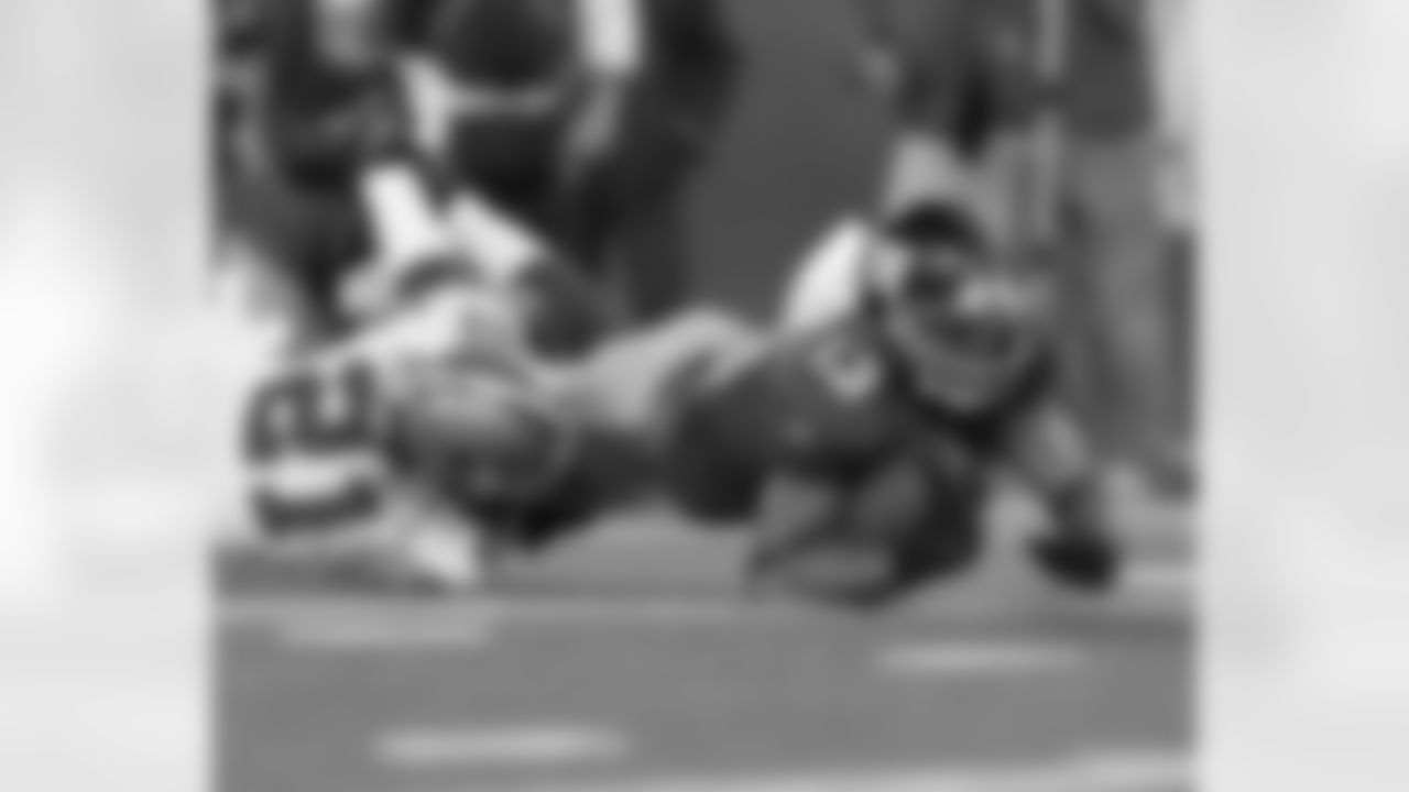 WR Ramses Barden stretches over the Cowboys defender for a first down.