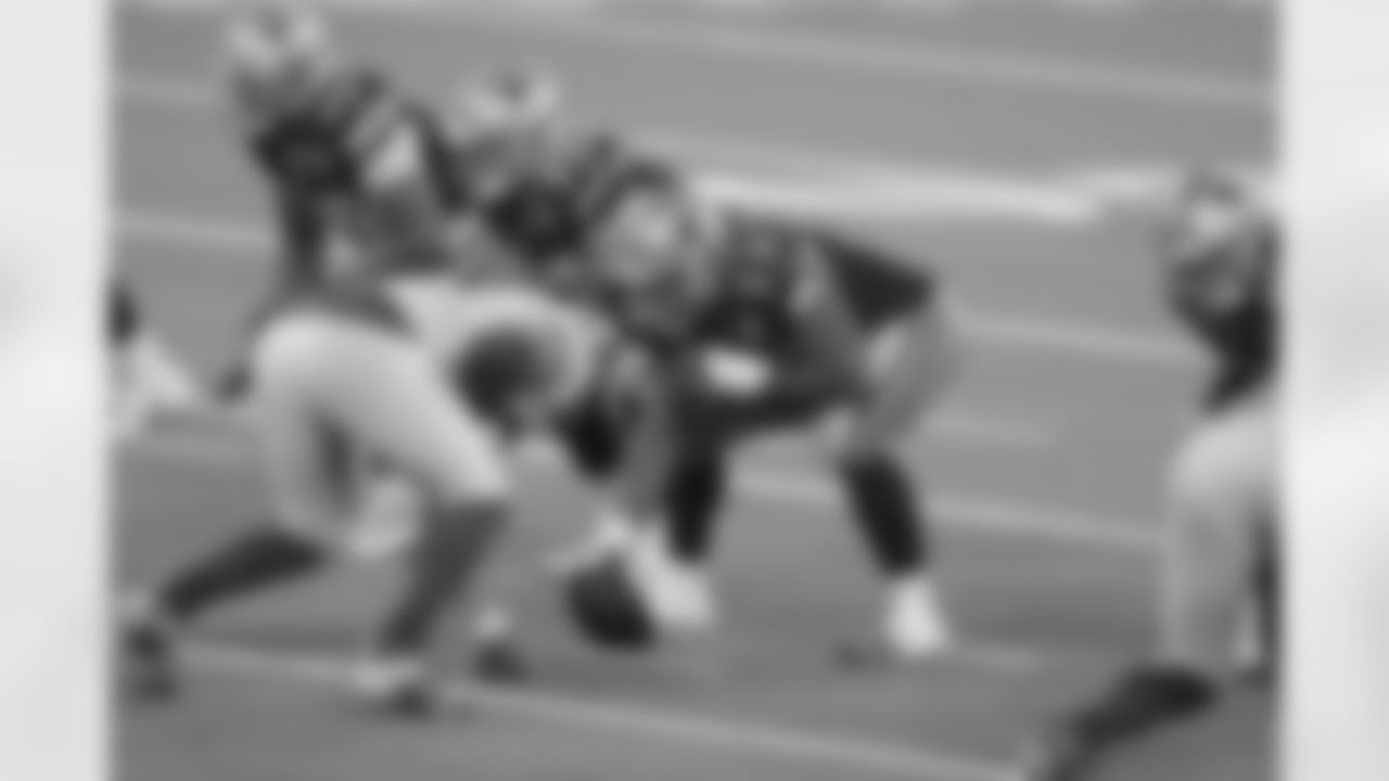 Dallas Cowboys center Joe Looney (73) gets ready to snap the ball with pressure from the Los Angeles Rams during an NFL football game, Sunday, Sep. 13, 2020 in Inglewood, Calif. (Ben Liebenberg via AP)