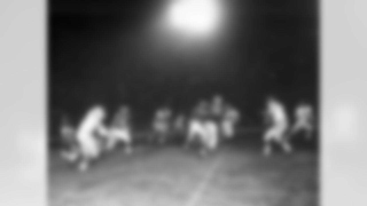 A night game between the Los Angeles Rams and the New York Giants at Los Angeles, Sept. 15, 1960. Identifiable players are: Rams Dick Bass (22), Charlie Bradshaw (79), and New York's Dick Nolan (25), Lindon Crow (41) and Jimmy Patton (20). Giants won, 20-6. (Vic Stein via AP)
