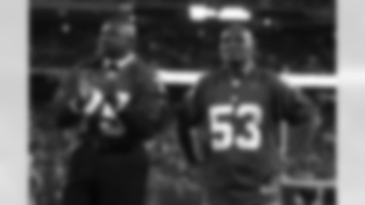 New York Giants former player George Martin, left, and Harry Carson, right, look on during a ceremony before an NFL football game between the Arizona Cardinals and the New York Giants Sunday, Oct. 25, 2009, in East Rutherford, N.J. (AP Photo/Mel Evans)
