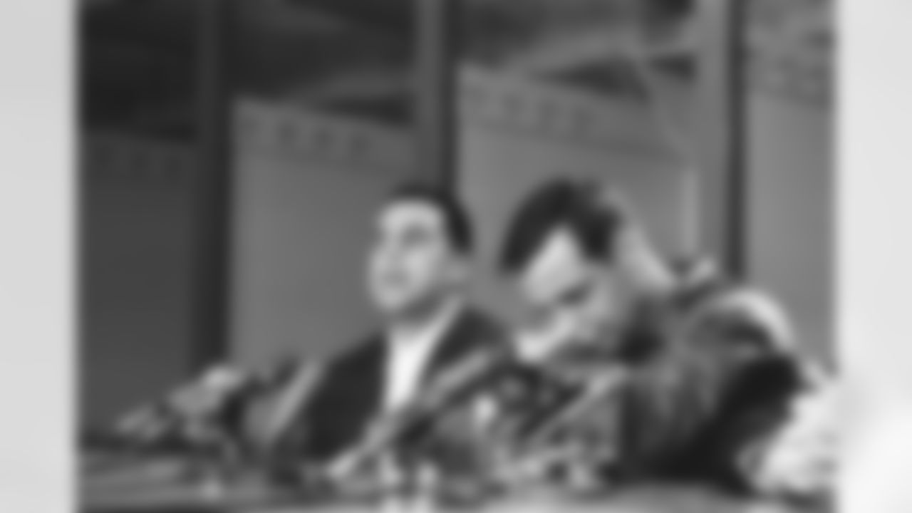 Sam Huff, veteran linebacker, is downcast during a Washington news conference on Dec. 12, 1967, in which he announced he would play his last pro football game on December 17. Otto Graham, coach of the Washington Redskins, is at left. Huff has been with the Redskins for four years after eight with the New York Giants. (AP Photo/Bob Daugherty)