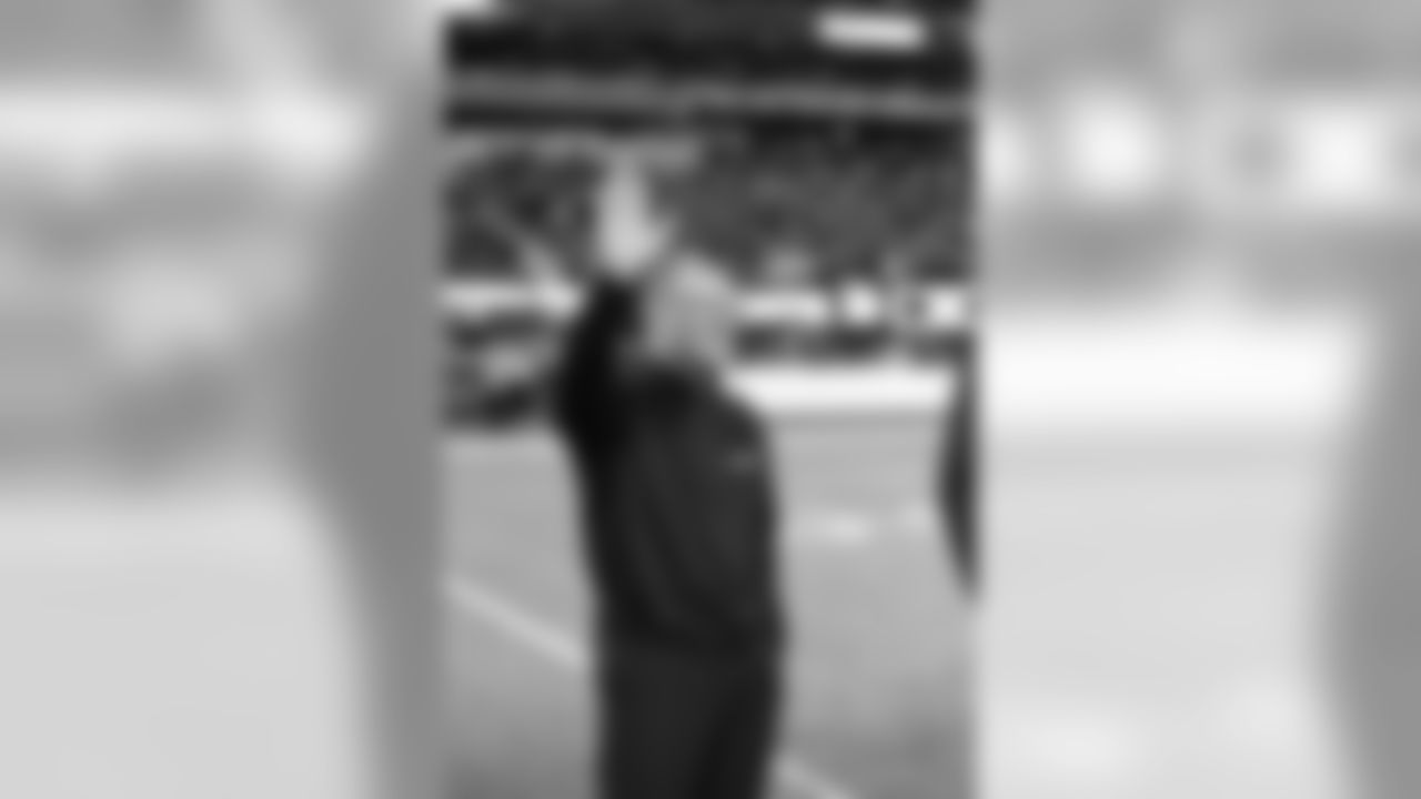 Jim Robinson waves to the crowd during halftime of the Giants-Colts game. Robinson played wide receiver for the Giants from 1976 to 1979 and returned to the team as a coach from 1998 to 2003.