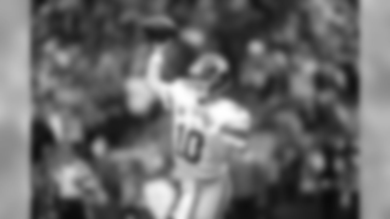 New York Giants quarterback Eli Manning throws a pass against the Seattle Seahawks in the second half of an NFL football game, Sunday, Nov. 9, 2014, in Seattle. (AP Photo/Scott Eklund)