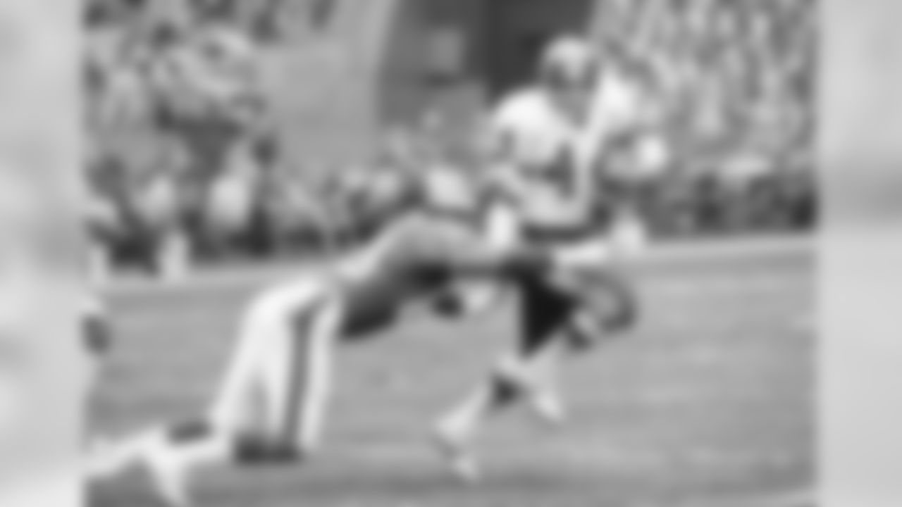Washington Redskins running back John Riggins (44) is about to be tackled by New York Giants defensive end Phil Tabor (80) during first quarter action at RFK Memorial Stadium in Washington, Dec. 19, 1982. (AP Photo/Ron Edmonds)
