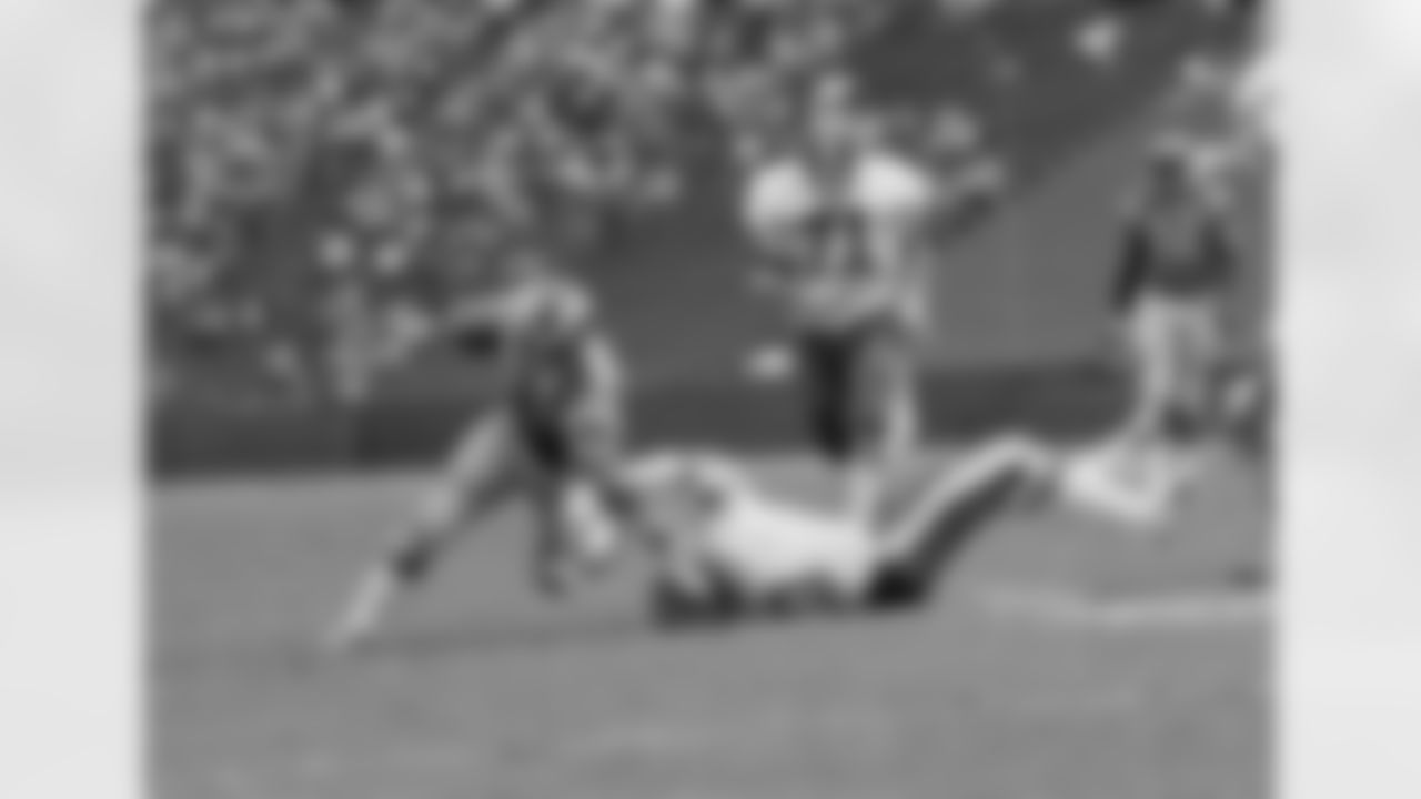 Rams' running back John Cappelletti, the former Heisman winner, is dragged down by a shirt tackle as he tried to circle the New York Giants' left side in Los Angeles Sunday, Sept. 26, 1976. Giant linebacker Brad Van Pelt pulls him down. At right is New York's Dave Gallagher. (AP Photo/George Brich)